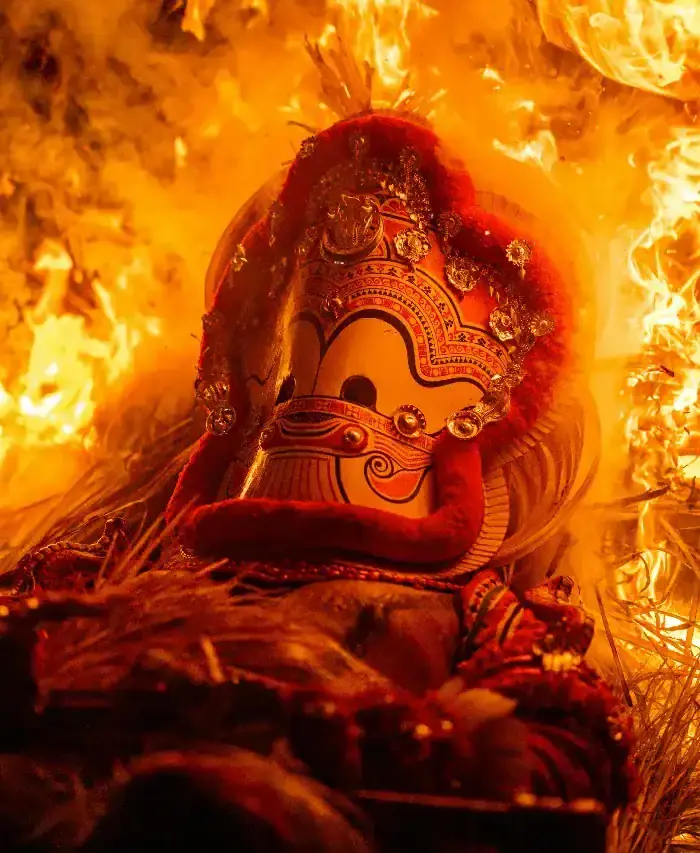 A Theyyam performer in ritual costume, Kerala
